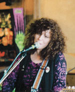 photograph of Carol singing